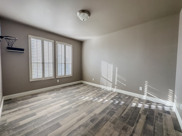 spare room with hardwood / wood-style flooring