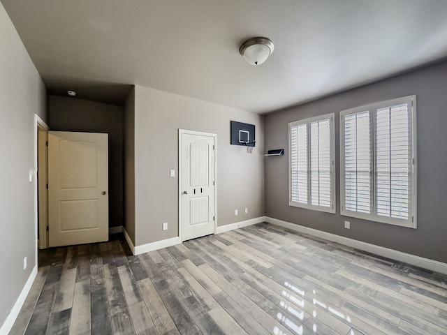 spare room with hardwood / wood-style floors