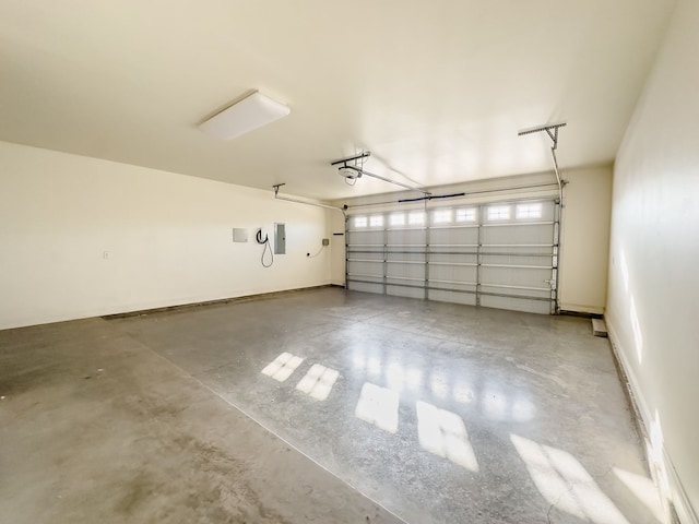 garage featuring a garage door opener and electric panel