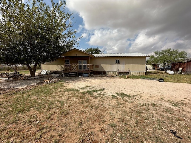 rear view of property with a deck