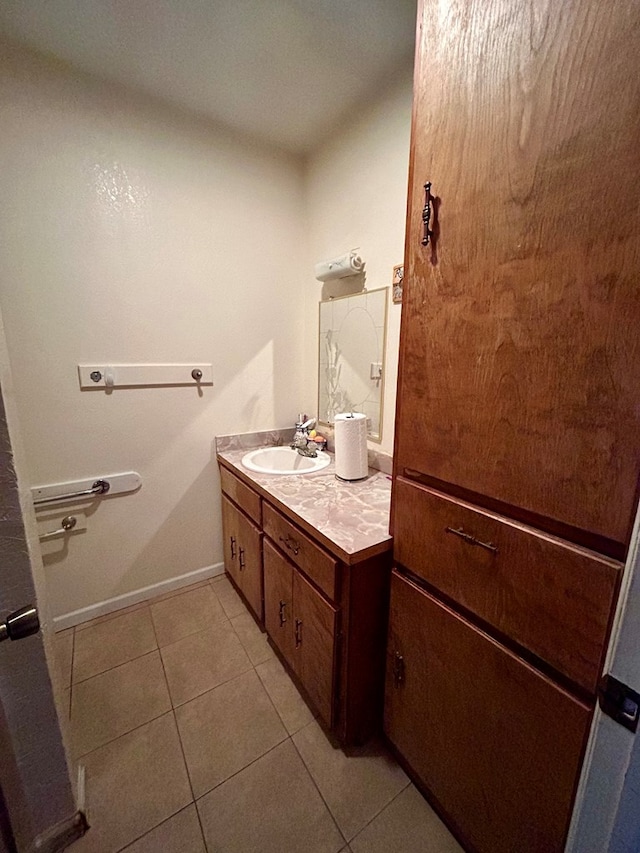 bathroom with tile patterned floors and vanity