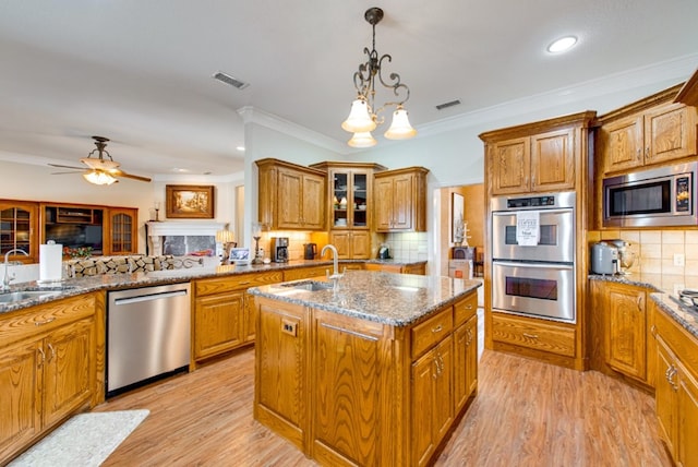 kitchen featuring visible vents, appliances with stainless steel finishes, and a sink