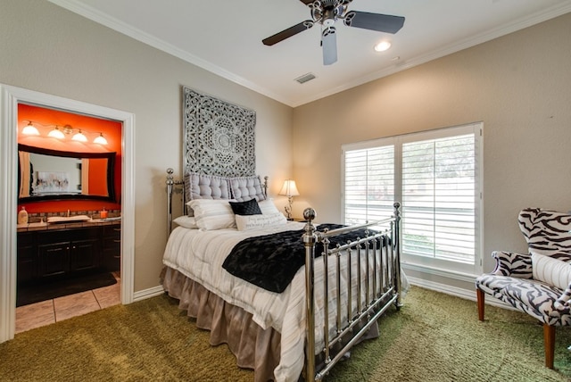 carpeted bedroom with baseboards, visible vents, ensuite bath, tile patterned flooring, and crown molding