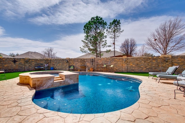 view of swimming pool featuring a fenced in pool, a fenced backyard, a patio, and an in ground hot tub