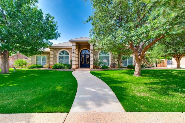 4609 Woodbar Ct, Midland, TX 79707 - view of front of home featuring a front yard and brick siding