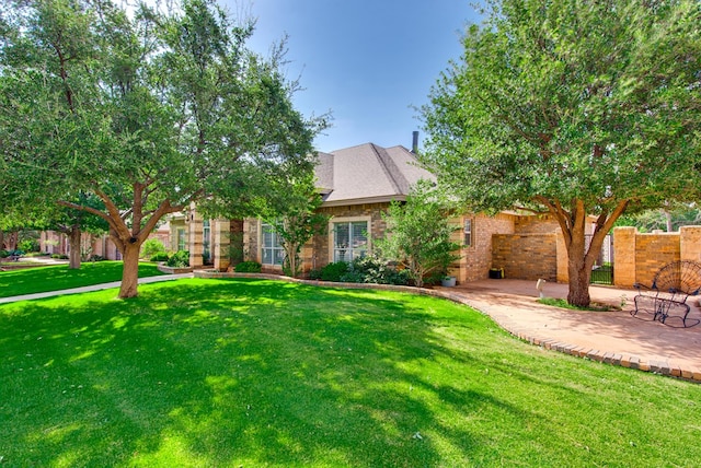 4609 Woodbar Ct, Midland, TX 79707 - view of property hidden behind natural elements with a patio area and brick siding