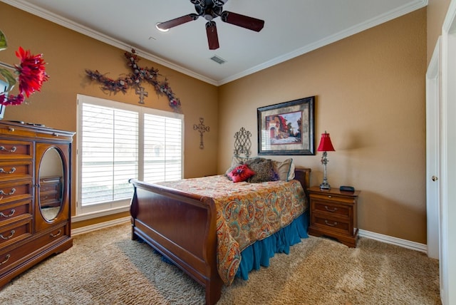 carpeted bedroom featuring baseboards, ceiling fan, visible vents, and crown molding