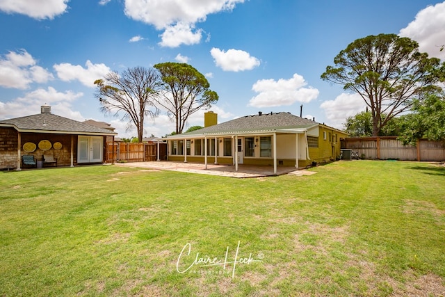 1700 Holloway Ave, Midland, TX 79701 - rear view of house featuring french doors, a patio, and a chimney