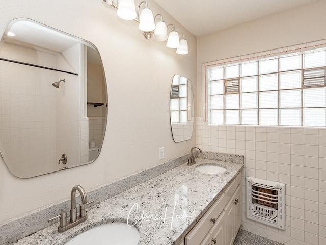 1700 Holloway Ave, Midland, TX 79701 - full bath with heating unit, double vanity, and tile walls