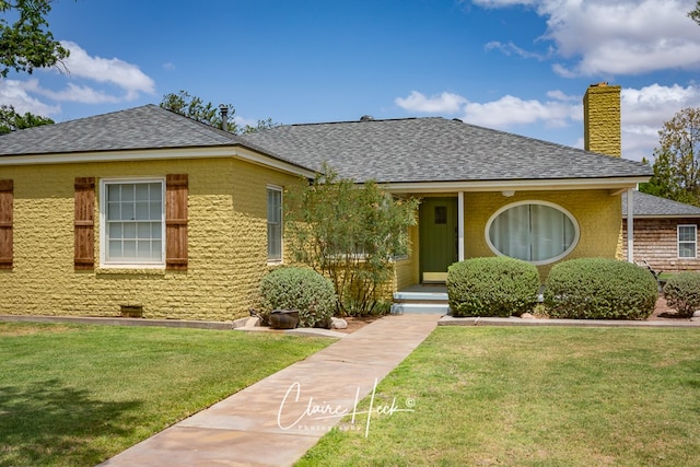 1700 Holloway Ave, Midland, TX 79701 - view of front facade with a chimney, roof with shingles, and a front lawn