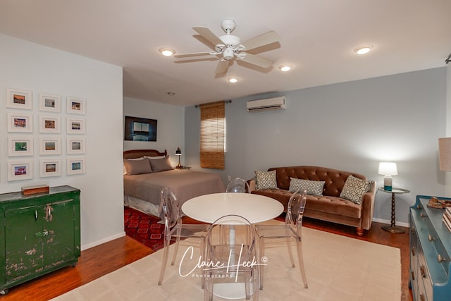 1700 Holloway Ave, Midland, TX 79701 - bedroom featuring a wall unit AC, wood finished floors, and recessed lighting