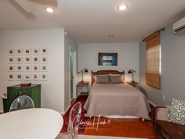 1700 Holloway Ave, Midland, TX 79701 - bedroom with an AC wall unit, recessed lighting, wood finished floors, and a ceiling fan