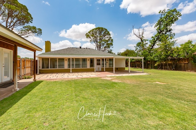 1700 Holloway Ave, Midland, TX 79701 - rear view of house featuring a patio, a chimney, and a fenced backyard