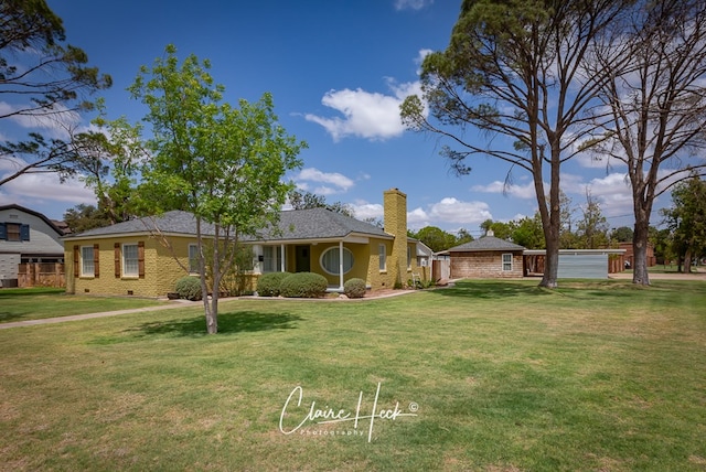 1700 Holloway Ave, Midland, TX 79701 - ranch-style house with a front lawn and a chimney