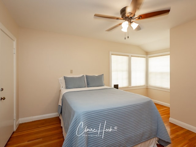 1700 Holloway Ave, Midland, TX 79701 - bedroom featuring wood finished floors, a ceiling fan, and vaulted ceiling