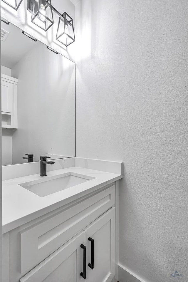 2200 S County Rd 1059, Midland, TX 79706 - bathroom featuring visible vents and vanity
