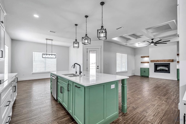 2200 S County Rd 1059, Midland, TX 79706 - kitchen with visible vents, green cabinetry, a fireplace, and a sink