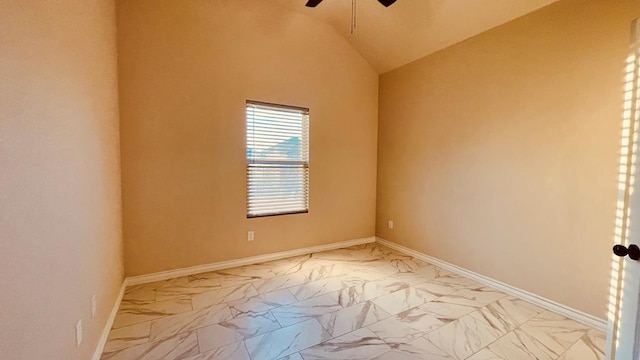 spare room with ceiling fan and vaulted ceiling