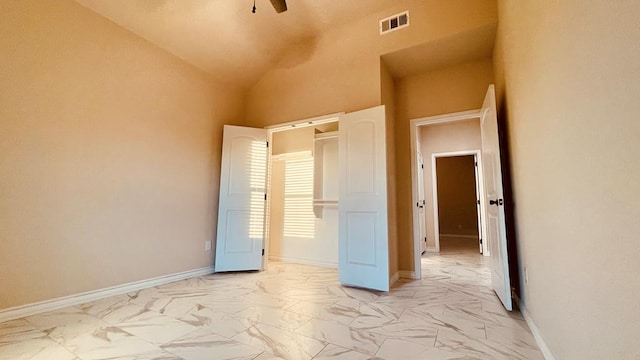 unfurnished bedroom with lofted ceiling and ceiling fan