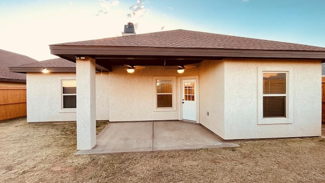 rear view of house with a patio area and ceiling fan