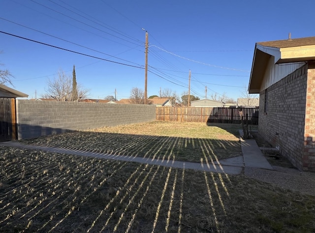 view of yard with a fenced backyard