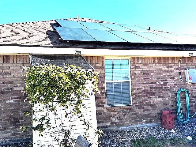 view of home's exterior with solar panels