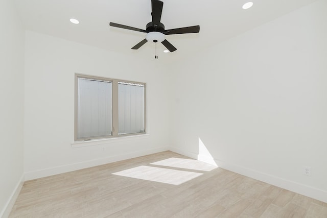 unfurnished room with ceiling fan and light hardwood / wood-style flooring