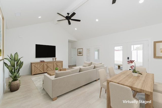 living room featuring ceiling fan, french doors, light hardwood / wood-style flooring, high vaulted ceiling, and beamed ceiling