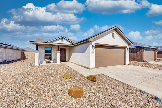 1109 Cajun St, Odessa, TX 79765 - single story home featuring brick siding, an attached garage, and driveway