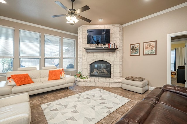 living room featuring crown molding, a fireplace, and ceiling fan