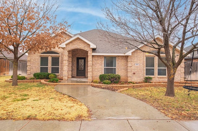 ranch-style house with a front lawn