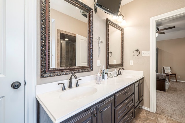 bathroom featuring ceiling fan and vanity