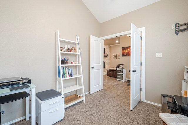 carpeted office space with lofted ceiling