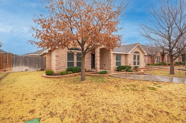 single story home featuring a front yard