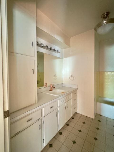 bathroom with tile patterned flooring and vanity