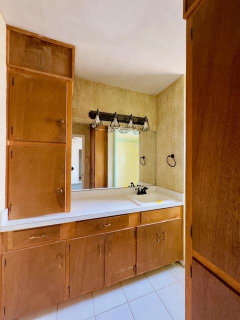 bathroom featuring tile patterned floors and vanity