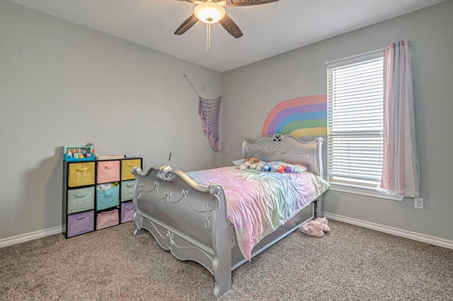 carpeted bedroom with ceiling fan and multiple windows