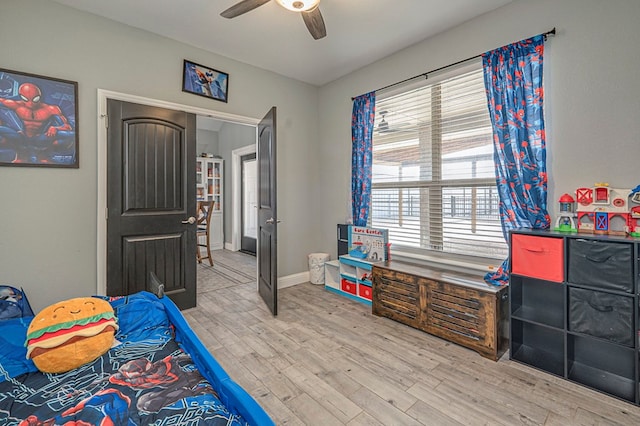 bedroom with hardwood / wood-style floors and ceiling fan