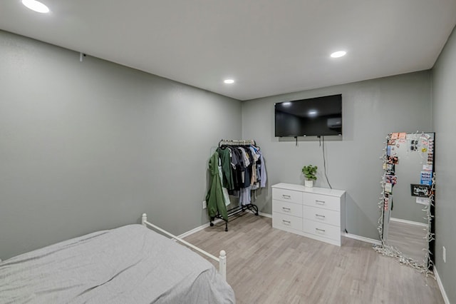 bedroom with light wood-type flooring