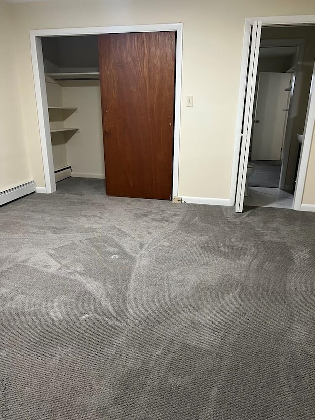 unfurnished bedroom featuring a baseboard radiator and light colored carpet