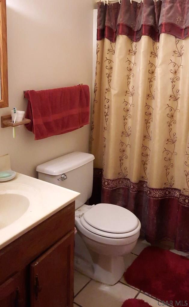 50 Wanda Way, Leechburg, PA 15656 - bathroom with vanity, tile patterned floors, and a shower with shower curtain
