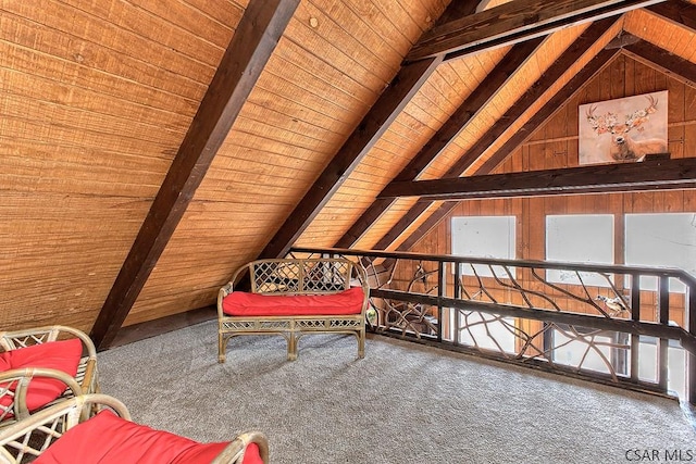 living area featuring lofted ceiling with beams, wooden walls, wooden ceiling, and carpet