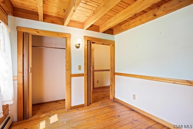 2484 Berlin Plank Rd, Berlin, PA 15530 - unfurnished bedroom featuring a baseboard radiator, wooden ceiling with exposed beams, hardwood / wood-style flooring, a closet, and baseboards
