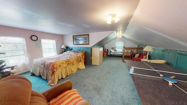 bedroom with lofted ceiling and carpet flooring