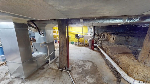 unfinished basement with independent washer and dryer