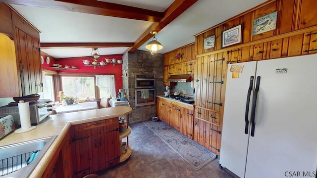 kitchen featuring sink, beamed ceiling, pendant lighting, stainless steel appliances, and decorative backsplash