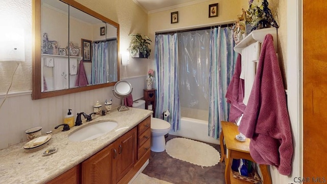 bathroom with crown molding, toilet, shower / tub combo, wainscoting, and vanity