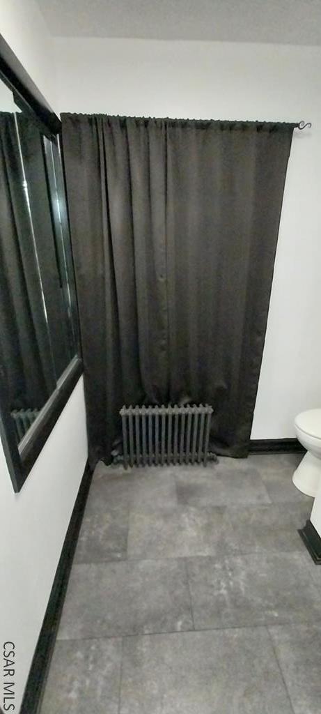 interior space featuring radiator heating unit