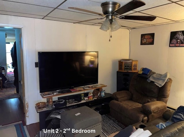 1804 Somerset Ave, Windber, PA 15963 - living room featuring ceiling fan, a decorative wall, wood finished floors, and a drop ceiling