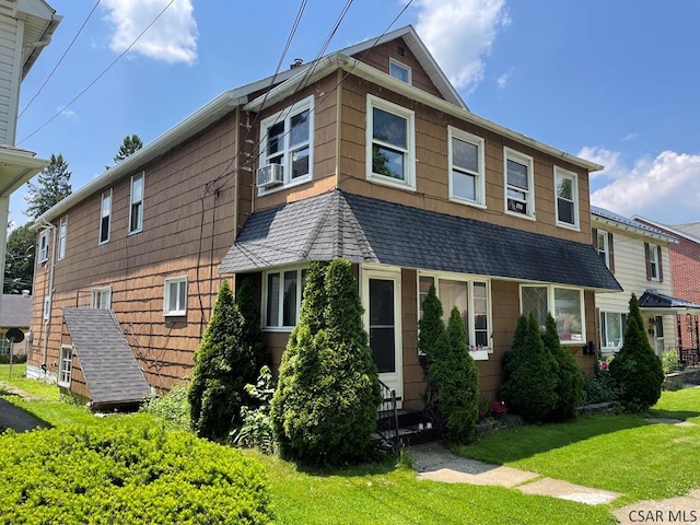 1804 Somerset Ave, Windber, PA 15963 - view of front facade featuring a front yard, cooling unit, and a shingled roof